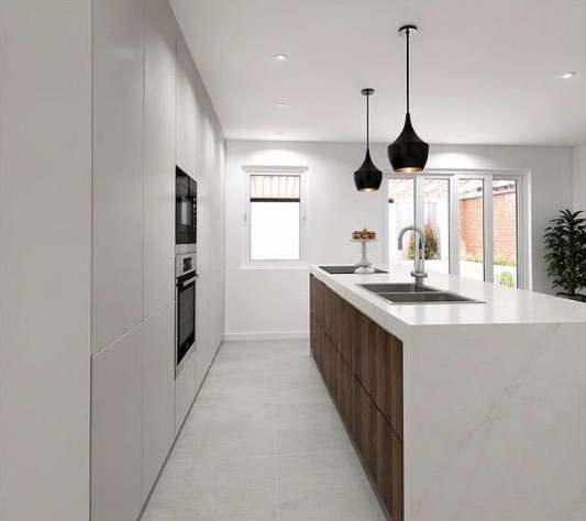 Keuken met greeploze kastenwand en ingebouwde ovens